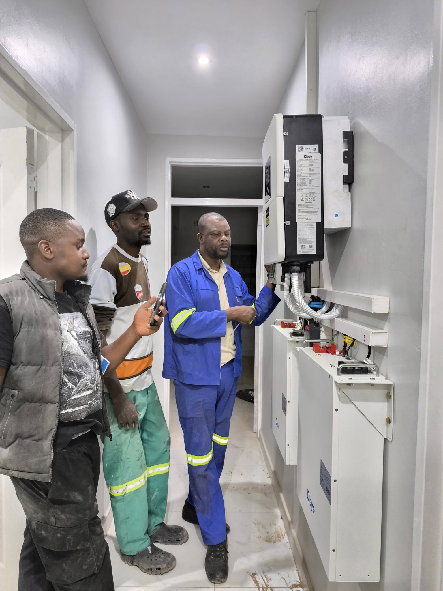 Solarpro explaining inverter operation to a client